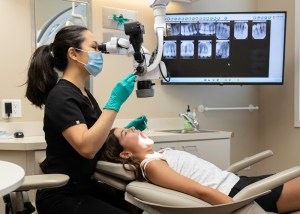 Examining patient teeth